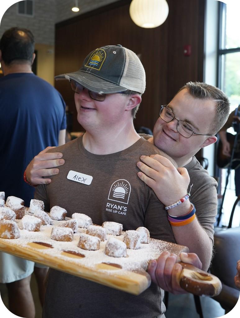 Ryan and Alex with a tray of baked goods